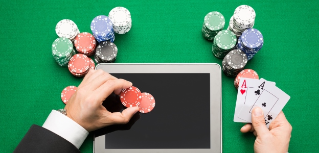 wallpaper poker chip with ipad and card in hand on green table